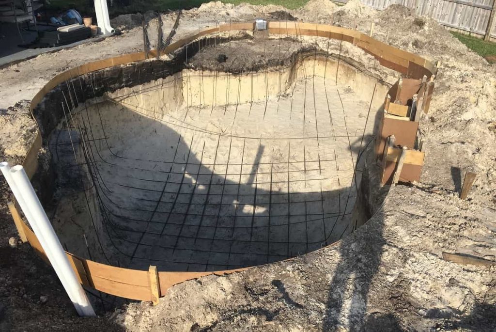 Concrete pools have a steel frame and then concrete is sprayed into it to form the shell.