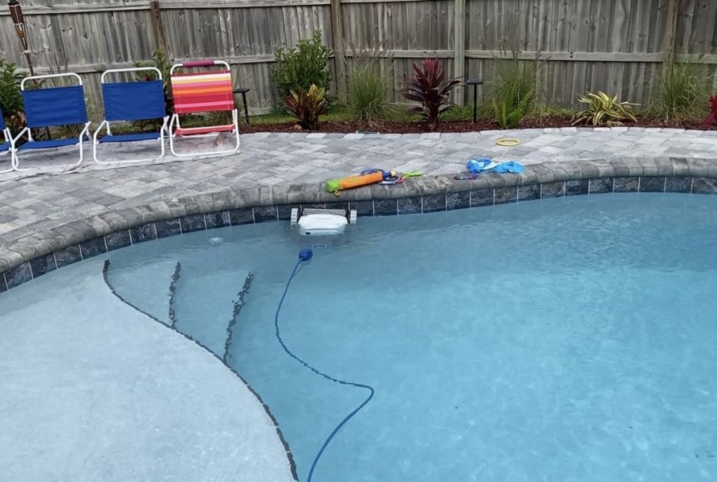 Robotic pool cleaners that also skim the waterline can help tremendously.