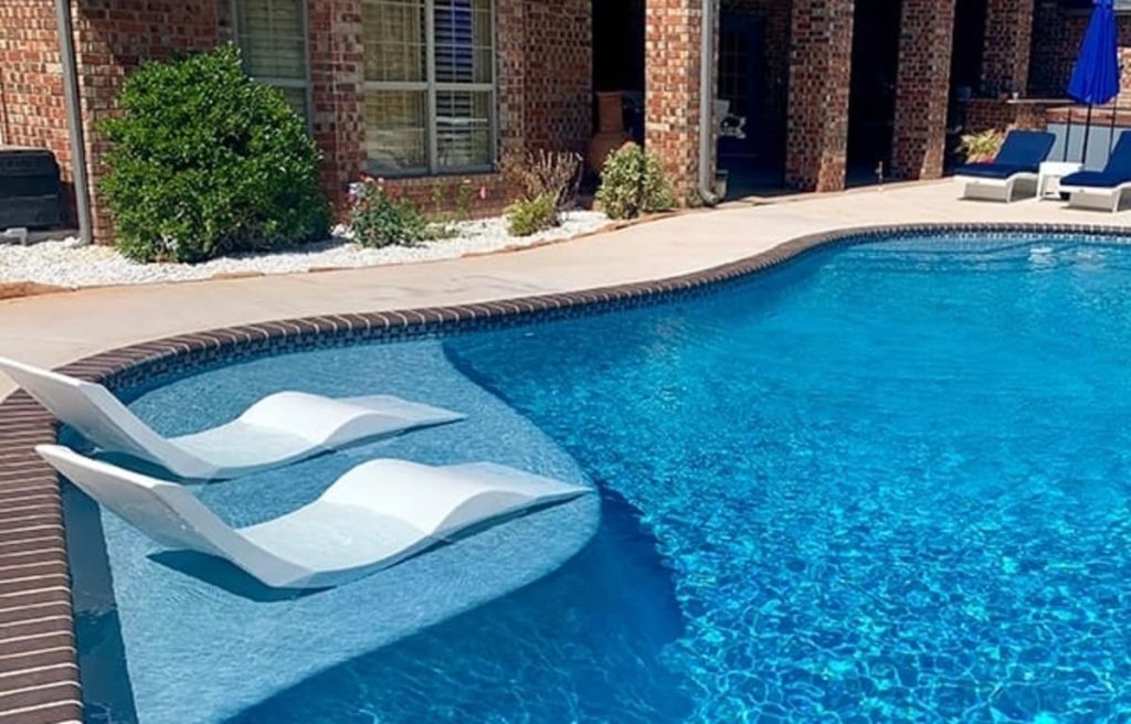 Ledge loungers are submersed with water to prevent them from moving on the tanning ledge.