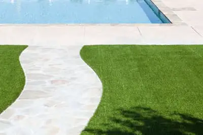 Pool water won't hurt artificial grass.