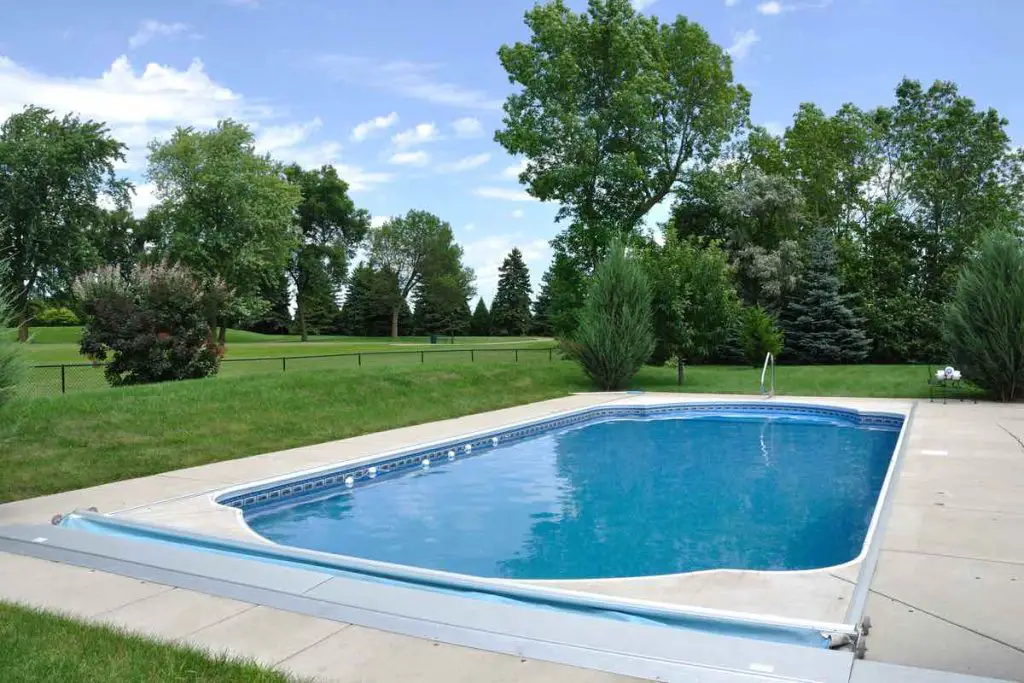 Backyard In-Ground Swimming Pool on a Sunny Summer Day