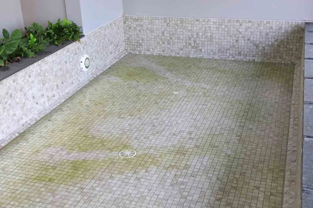Empty swimming pool for repair tiles.