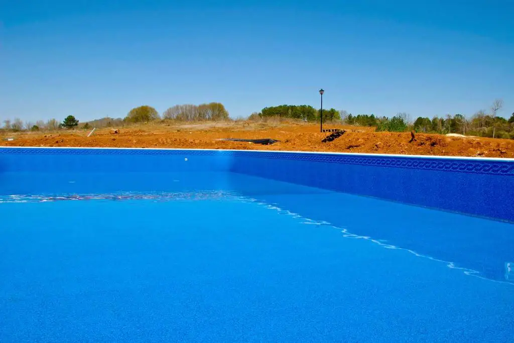 New Swimming Pool Liner being installed in a in ground pool